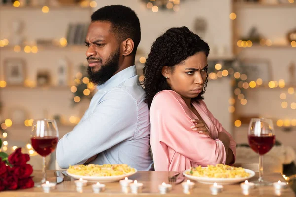 Unhappy Black Couple Sitting Back To Back On Date