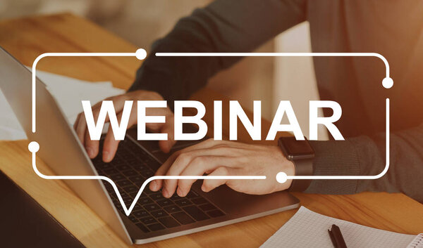 Webinar inscription over unrecognizable businessman using laptop