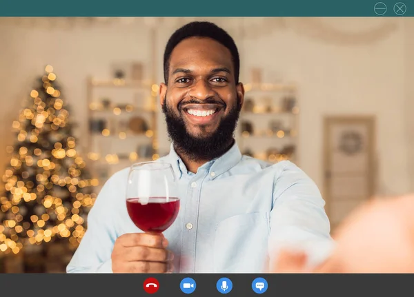 Black man having online call, drinking wine — Stock Photo, Image