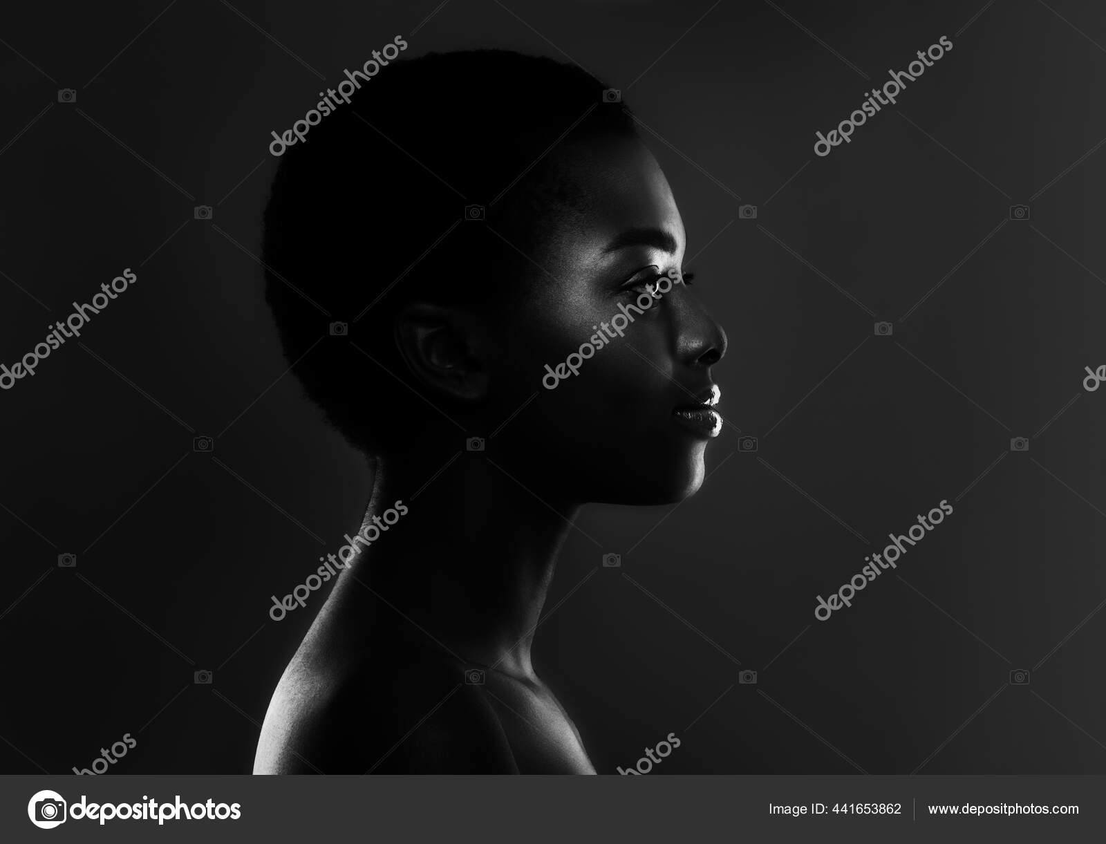Black And White Profile Shot Of Beautiful African Female Over Dark