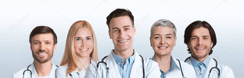 Group Of Five Professional Doctors Posing Over White Studio Background