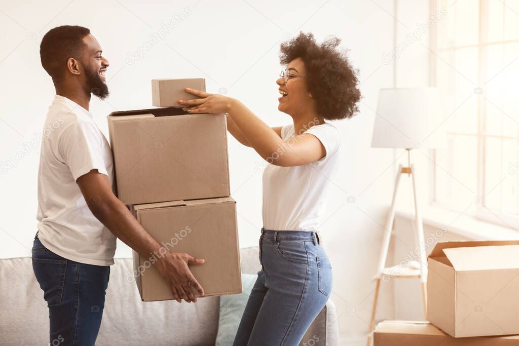 Black Spouses Packing Moving Boxes Preparing For Relocation Standing Indoor