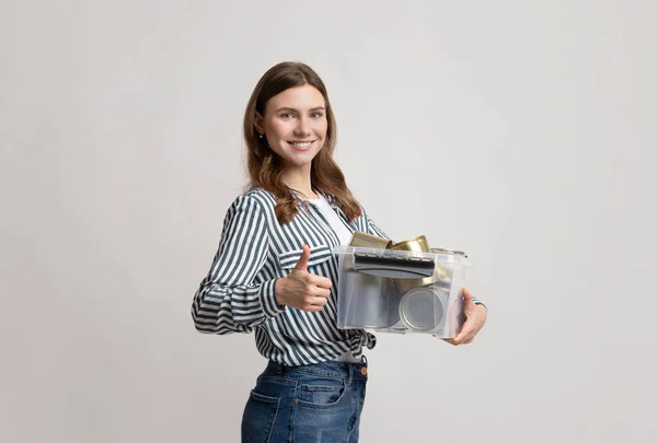 Smiling Nature-Friendly Woman Holding Container With Metal Waste And Showing Thumb Up — Stock Photo, Image