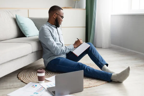 Black Student Guy Learning At Home Taking Notes Sitting Indoor