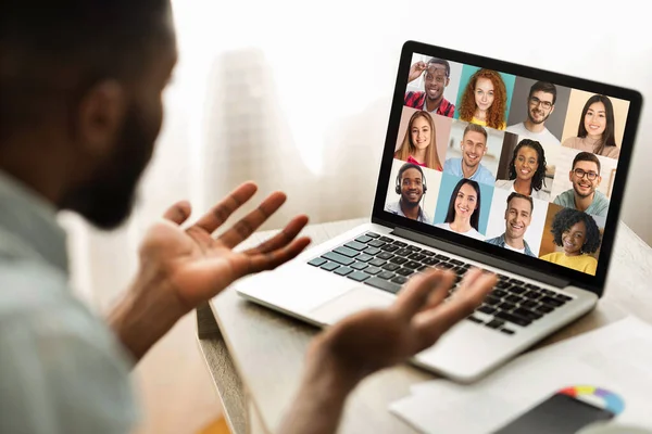 Online Meeting. Group Of Multiracial People Communicating Via Video Call On Laptop