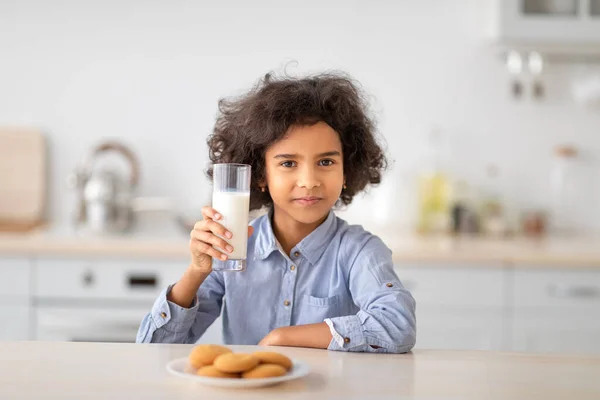 Portrait Of Cute Little Afro Girl Holding Glass Of Milk