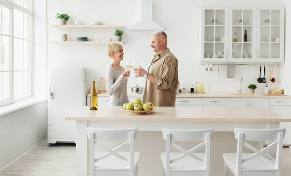 Happy couple in love have romantic dinner, toasting, enjoy home comfort and spare time