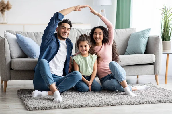 Family Protection. Mom And Dad Making Roof Of Hands Above Their Daughter — Stock Photo, Image