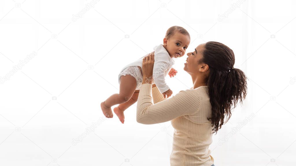 African Mommy Carrying Baby Toddler Playing With Infant, White Background