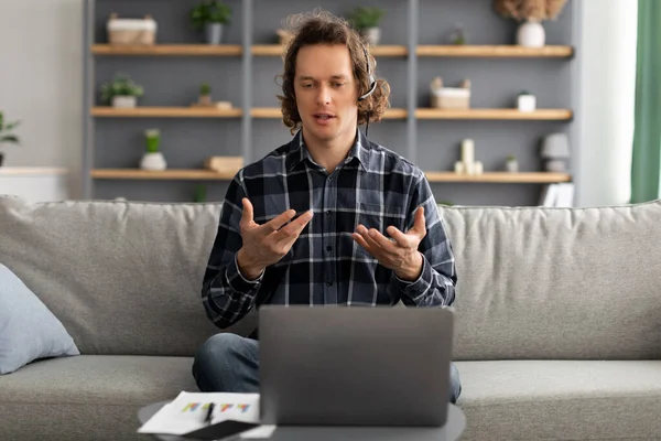 Man Video Calling At Laptop Having Virtual Meeting At Home