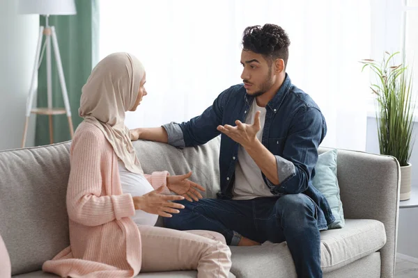 Pregnancy And Relationship Problems. Pregnant Muslim Spouses Arguing At Home