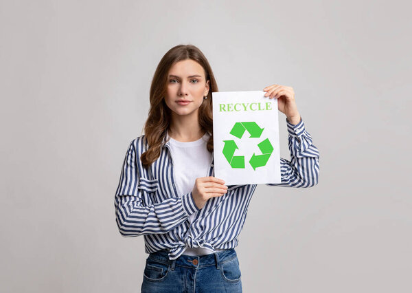 Young Environmental Activist Lady Holding Placard With Green Recycle Sign