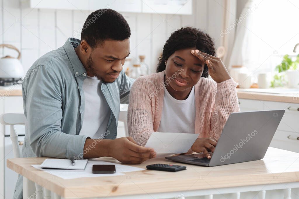 Worry Black Spouses Calculating Family Budget In Kitchen, Reading Financial Papers