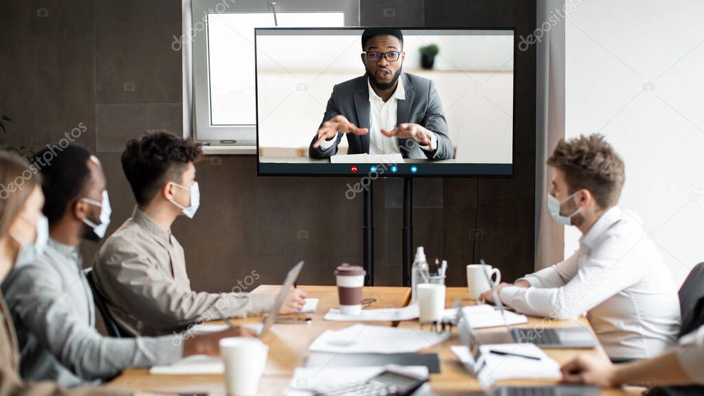 Black ceo making online video call to employees