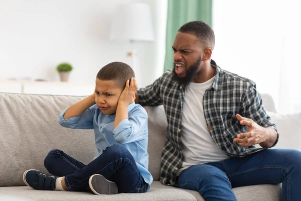 Aggressive Black Father Shouting At Unhappy Kid Boy At Home — Stock Photo, Image