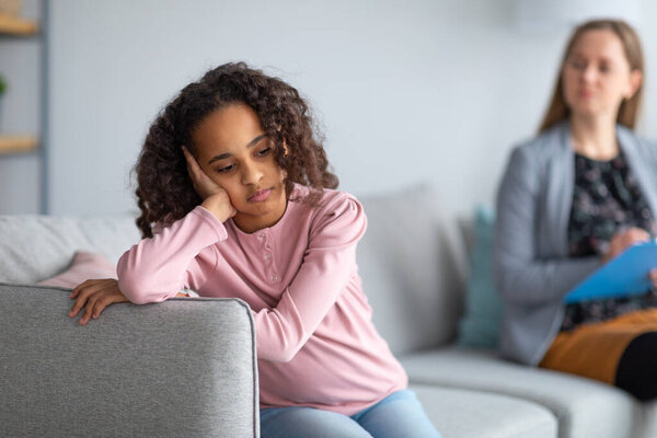 Drone courier flying up with carton package in city