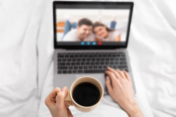 Virtual Meeting. Unrecognizable Female Drinking Coffee And Having Video Call With Friends