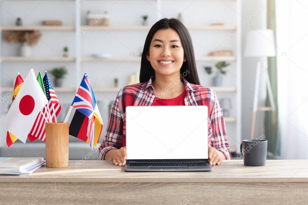 Online Language Courses. Happy Asian Woman With Laptop And International Flags, Mockup