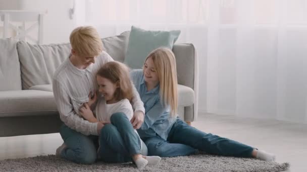 Happy Mom Tickling Daughters Having Fun At Home — Stock Video
