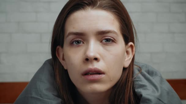 Portrait Of Depressed Woman Looking At Camera Sitting In Bedroom — Stock Video