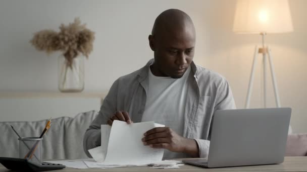 Black Businessman Doing Paperwork Reading Financial Reports Sitting In Office — Vídeo de Stock