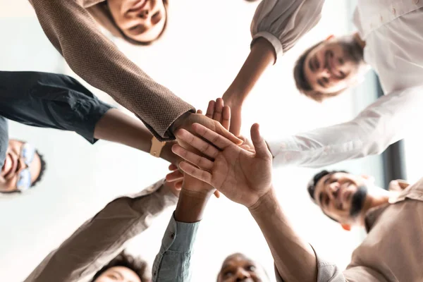 Diverse business people putting their hands together in cirle — Stock Photo, Image