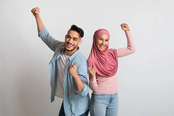 Joy Of Win. Happy Excited Muslim Couple Celebrating Success With Raised Fists — Stok Foto