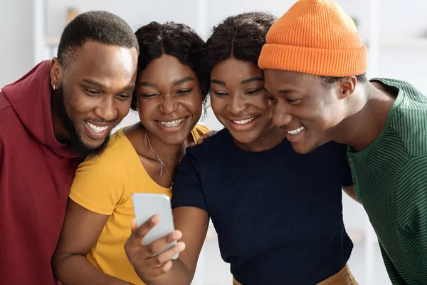 Happy african american friends having video chat via smartphone — Foto de Stock