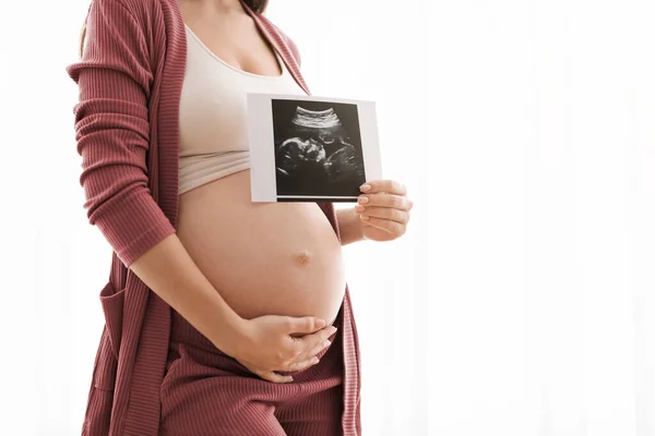 Closeup Shot Of Pregnant Lady Showing Baby Ultrasound Photo And Embracing Belly — Photo