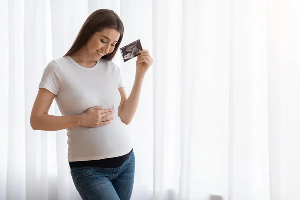 Maternity Concept. Pregnant Lady Holding Ultrasound Photo Of Baby And Embracing Belly — Stock Fotó