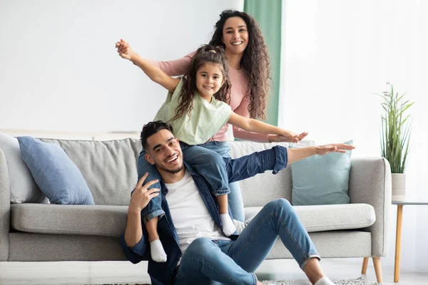 Portrait Of Happy Middle Eastern Parents Bonding With Their Child At Home — Foto de Stock