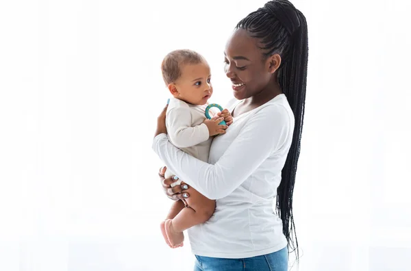 Happy African American mom hugging her cute infant — Stock Photo, Image