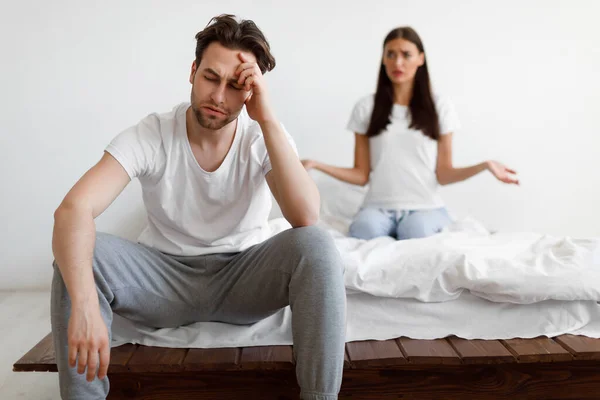 Married Couple Having Quarrel, Sitting In Bedroom At Home — Stock Photo, Image