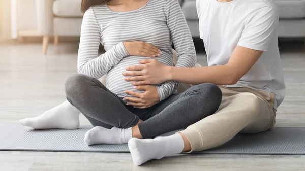 Unrecognizable man touching his pregnant wife big belly — Stock Photo, Image