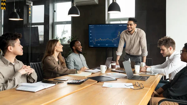 Colleagues having meeting in board room, businessman giving speech — Stock Photo, Image