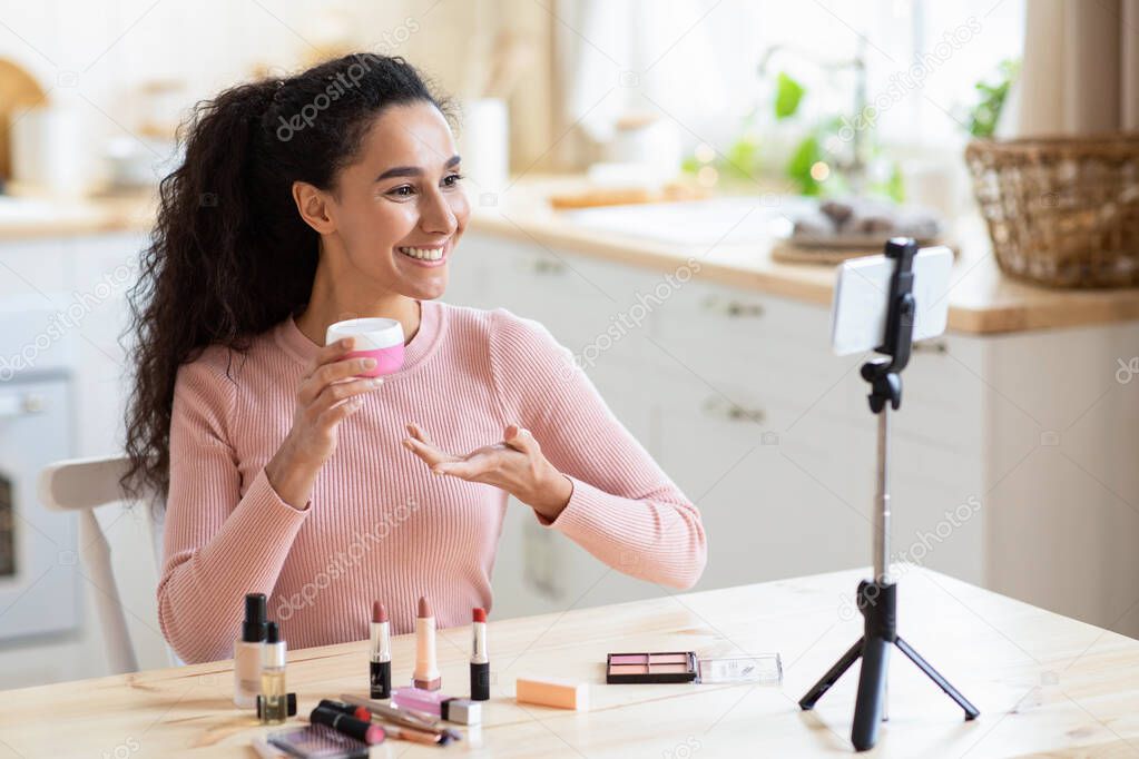 Video Review. Beautiful Young Smiling Woman Demonstrating New Makeup Products At Camera