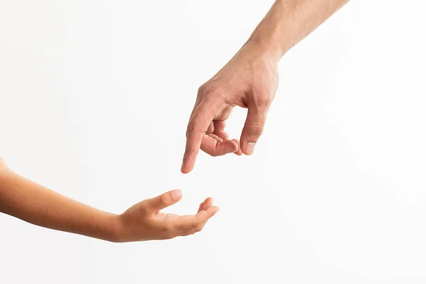 Closeup of father and daughter reaching hands — Stock Photo, Image