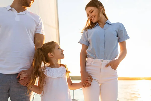 Family Sailing Enjoying Yacht Ride Holding Hands Standing On Deck