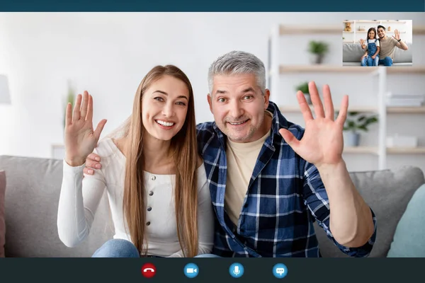 Cheerful mature couple having video chat with their son and granddaughter, waving at webcam, view of screen — Stock Photo, Image