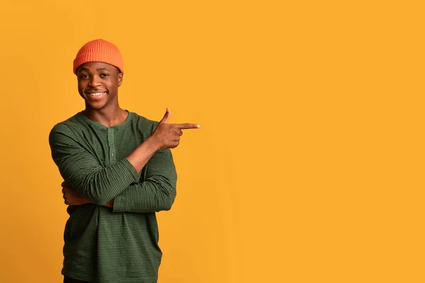 Look At This. Positive Young Black Man Pointing Aside At Copy Space — Stockfoto