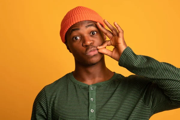 Keep Quiet. Young Black Hipster Guy Making Zipping Mouth Gesture — Stockfoto