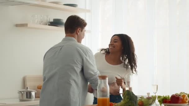 Cheerful Multiethnic Couple Dancing Having Fun In Kitchen — Stok Video