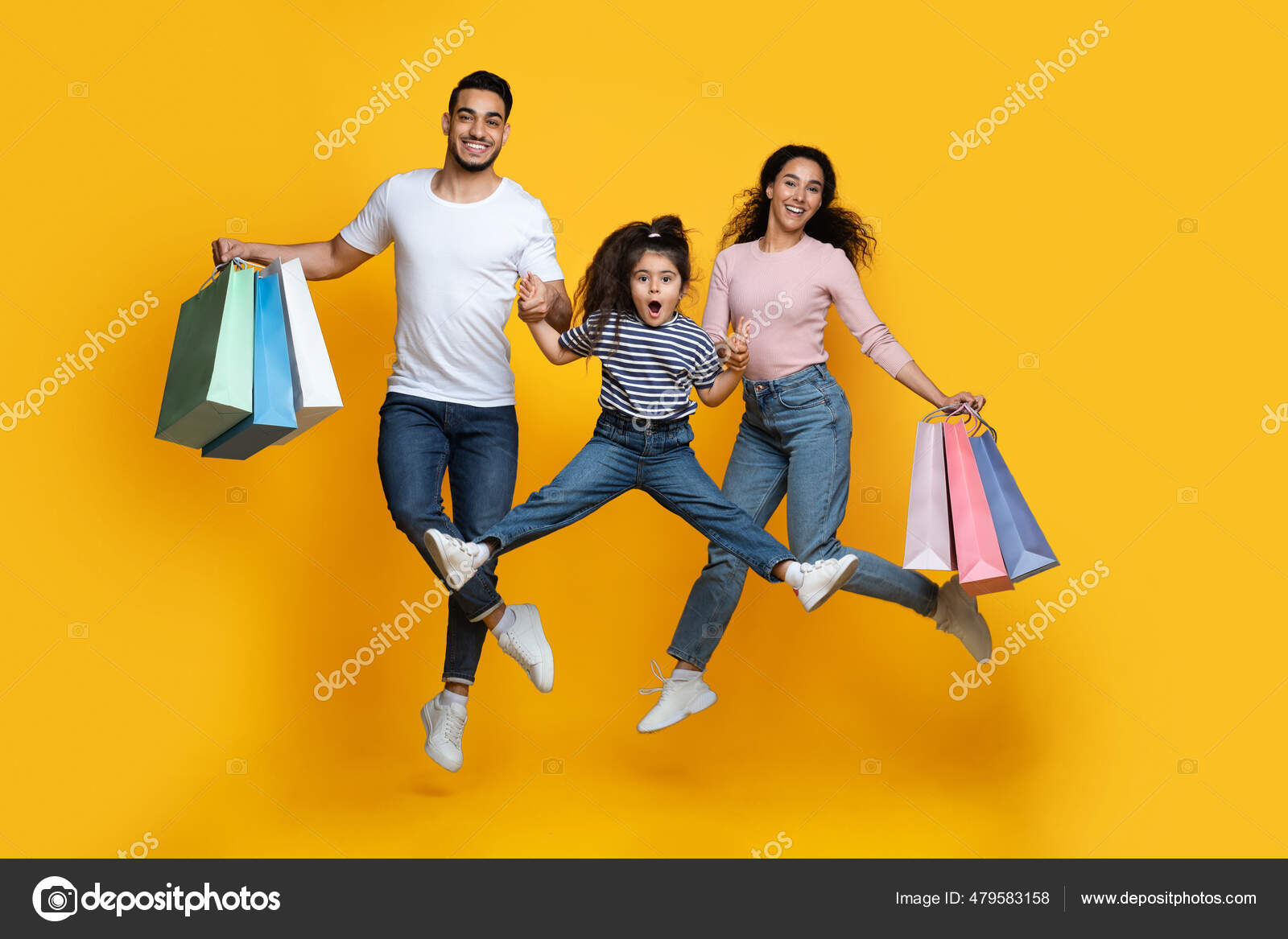 Seasonal Sales. Happy Middle Eastern Family Of Three Jumping With Shopping  Bags Stock Photo by ©Milkos 479583158