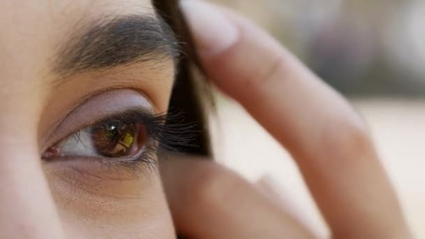 Closeup Shot Of Brown Female Eye, Young Woman Posing Outdoors — Stock Video