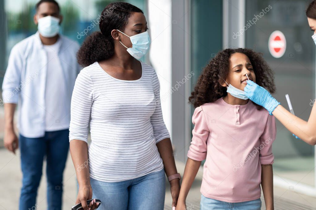 Medical Worker Making Covid-19 PCR Test For Black Girl