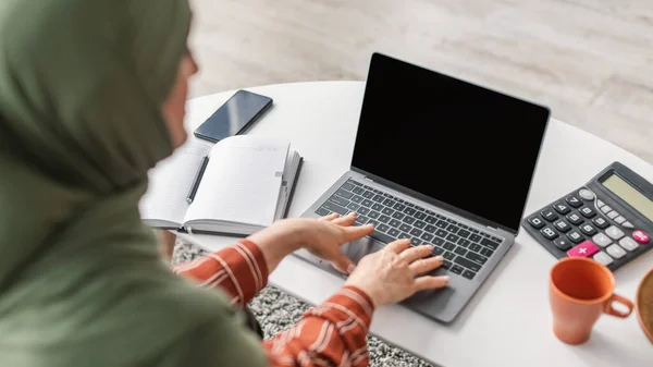 Senior Muslim Lady Using Laptop With Empty Screen Indoor, Back-View — Stock Photo, Image