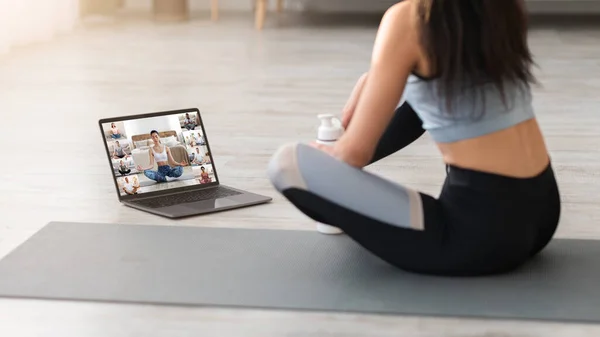 Unrecognizable Woman Having Group Yoga Lesson Online With Laptop At Home