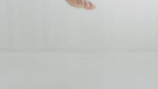 Feet care concept. Close up shot of unrecognizable barefoot woman stepping on floor and going away, empty space — Stock Video
