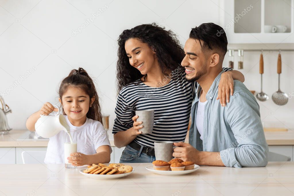 Loving middle-eastern family enjoying healthy breakfast together