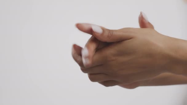 Skin nutrition. Unrecognizable black woman applying moisturizing body lotion on hands, using rich nourishing cream — Stock Video